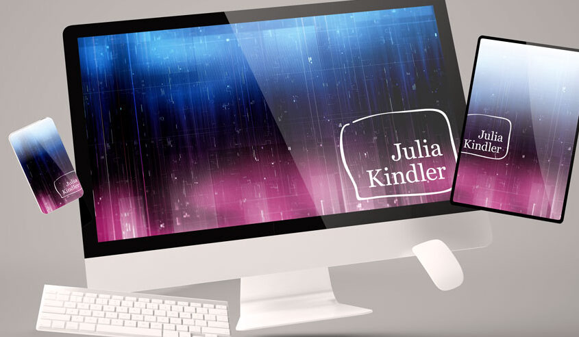 Computer, tablet, and phone with Julia Kindler logos